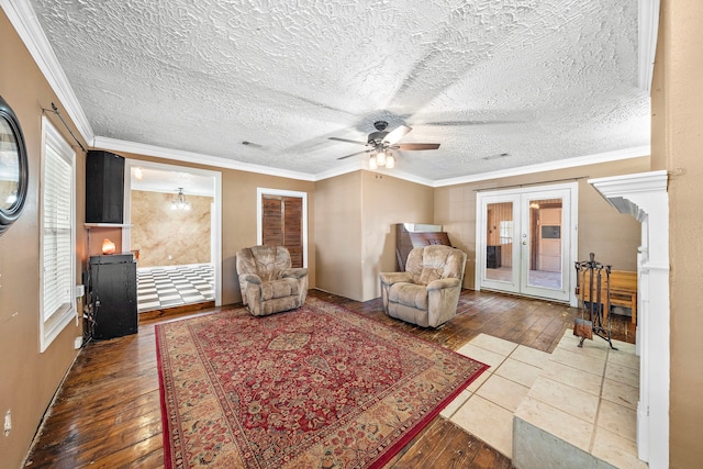 living room with wood-type flooring, a wealth of natural light, and french doors