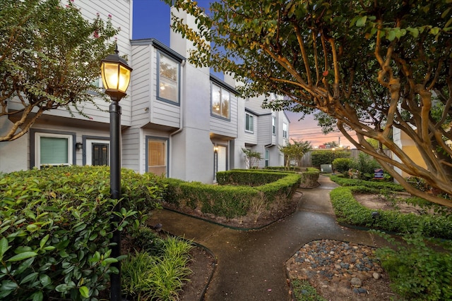 view of property exterior at dusk