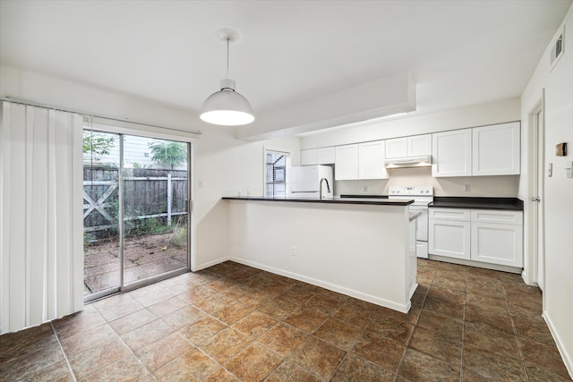 kitchen with kitchen peninsula, white appliances, sink, pendant lighting, and white cabinetry