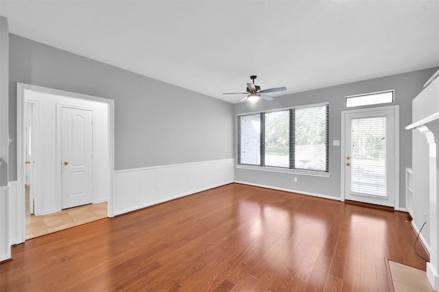 empty room with ceiling fan and wood-type flooring