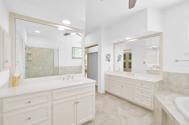 bathroom featuring ceiling fan, tile patterned flooring, vanity, and independent shower and bath