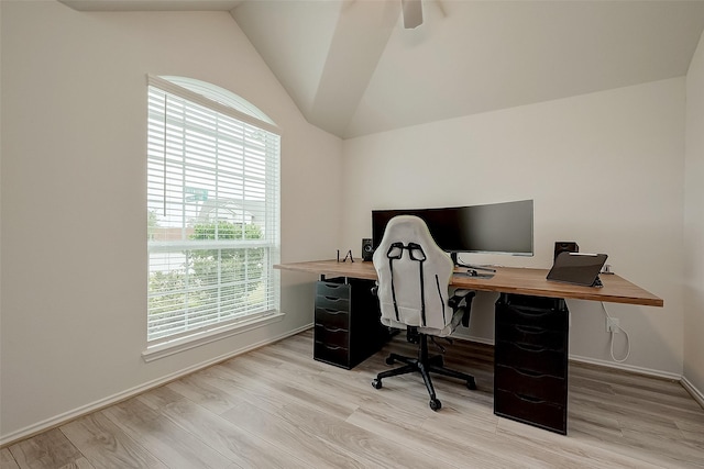 office space featuring light wood-type flooring and lofted ceiling