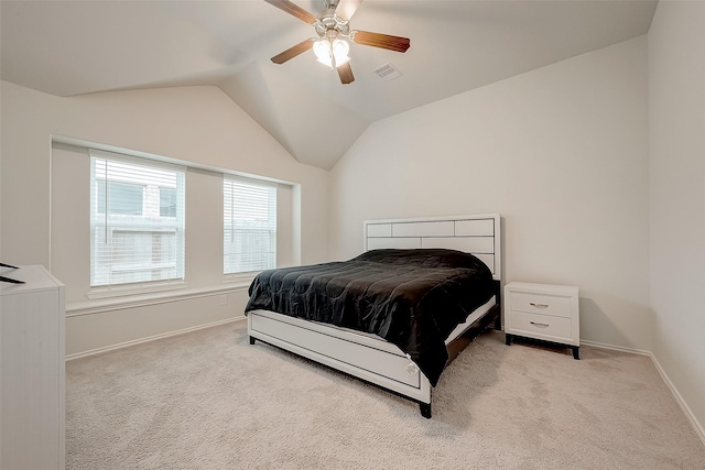 carpeted bedroom featuring ceiling fan and vaulted ceiling