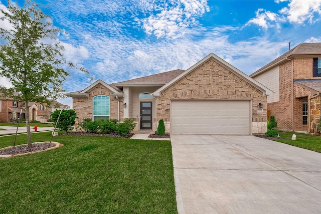 view of front of home with a garage and a front lawn