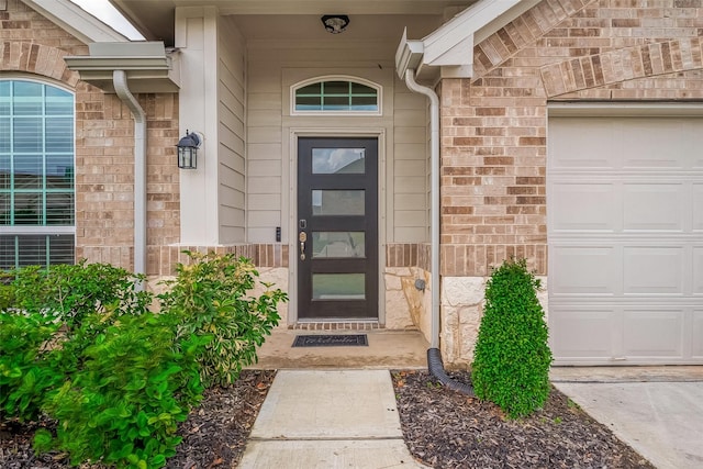 property entrance featuring a garage