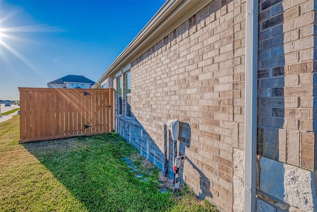 view of home's exterior featuring a yard