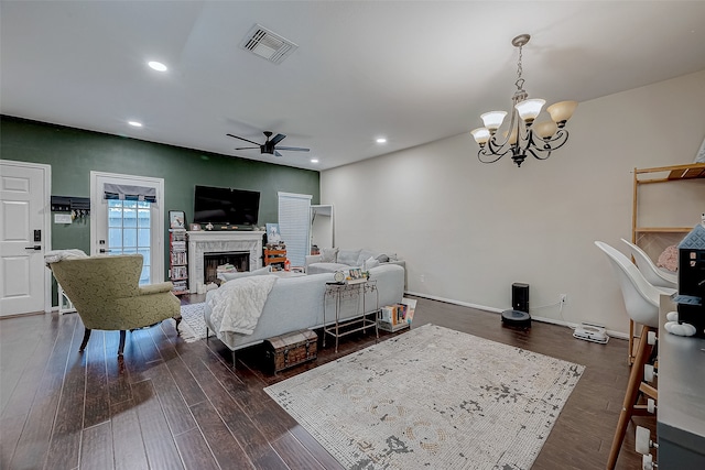 bedroom with access to outside, dark wood-type flooring, and ceiling fan with notable chandelier