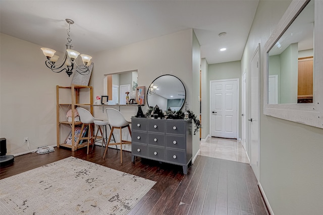 interior space with dark hardwood / wood-style flooring and a chandelier