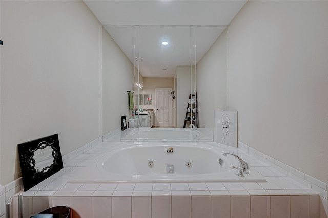 bathroom with tiled bath