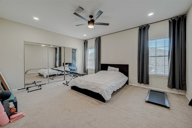 carpeted bedroom featuring ceiling fan