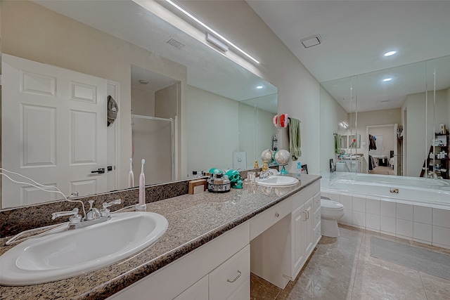 full bathroom featuring tile patterned floors, vanity, toilet, and independent shower and bath