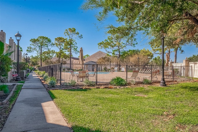 view of yard with a community pool