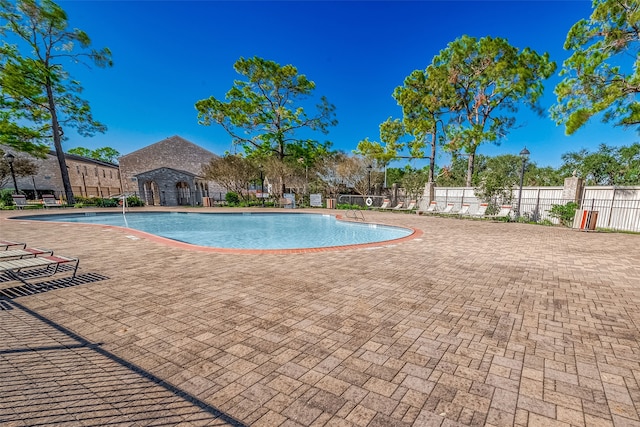 view of swimming pool with a patio area