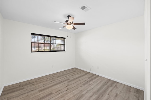 unfurnished room with ceiling fan and light wood-type flooring