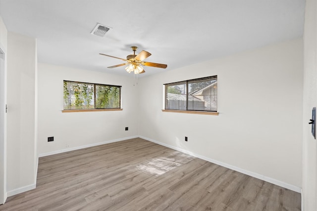 unfurnished room with ceiling fan and light hardwood / wood-style flooring