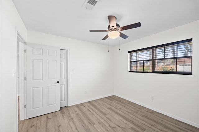 unfurnished bedroom featuring ceiling fan and light hardwood / wood-style flooring