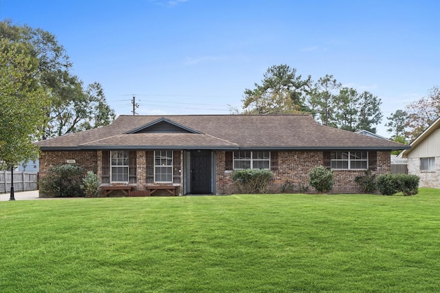 ranch-style home featuring a front yard