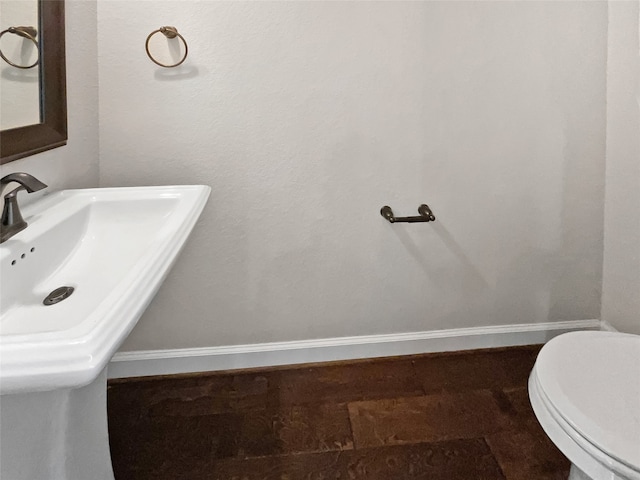 bathroom featuring toilet and sink