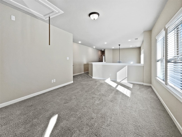 unfurnished living room with carpet flooring