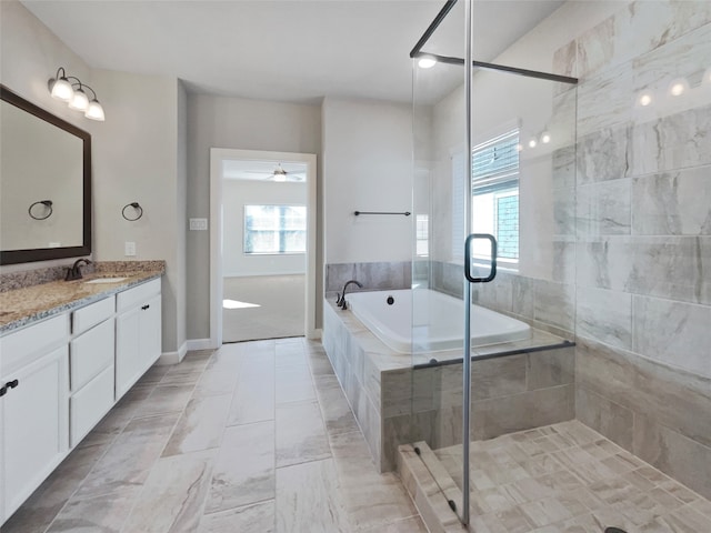 bathroom with vanity, separate shower and tub, a wealth of natural light, and ceiling fan