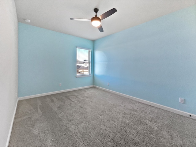 spare room featuring carpet flooring and ceiling fan