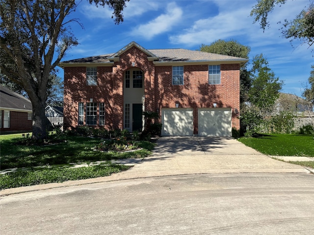 view of front of home with a garage and a front lawn