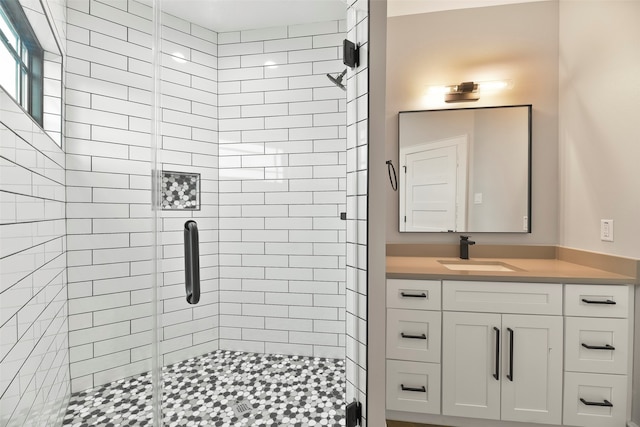 bathroom with vanity and an enclosed shower