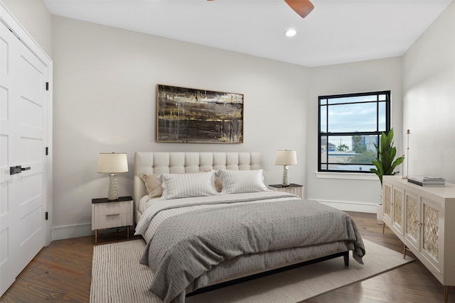 bedroom with dark wood-type flooring