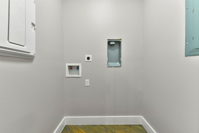 washroom featuring hardwood / wood-style floors, hookup for an electric dryer, electric panel, and washer hookup