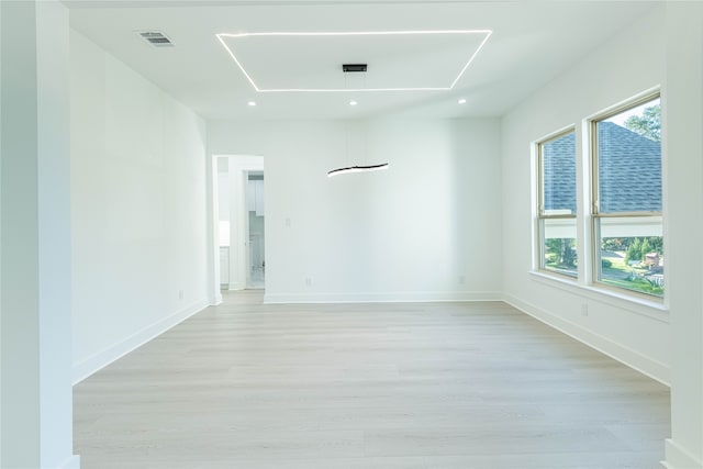 spare room featuring light hardwood / wood-style floors