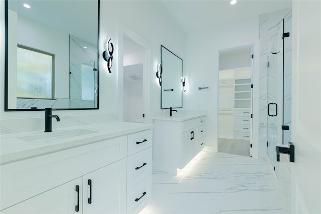 bathroom with vanity and an enclosed shower