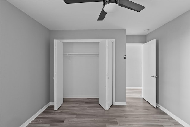 12900 Walden Rd Unit 419D, Montgomery, TX 77356 - unfurnished bedroom featuring wood finished floors, a closet, and baseboards