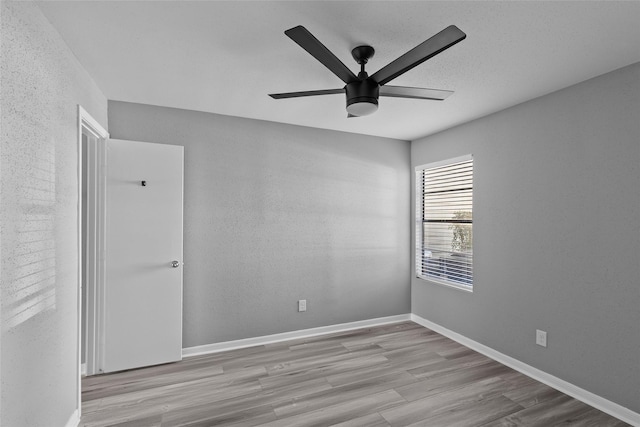 12900 Walden Rd Unit 419D, Montgomery, TX 77356 - empty room featuring a ceiling fan, wood finished floors, and baseboards