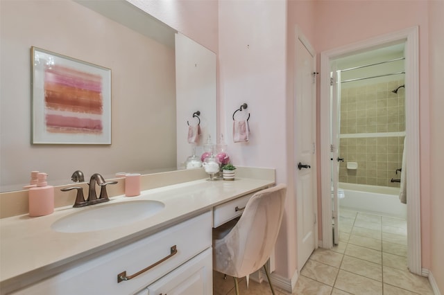 bathroom featuring tile patterned floors, vanity, and tiled shower / bath