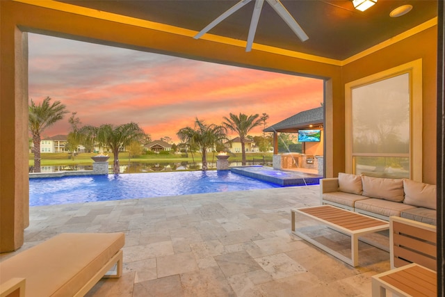 pool at dusk featuring an outdoor living space, a hot tub, pool water feature, a water view, and a patio