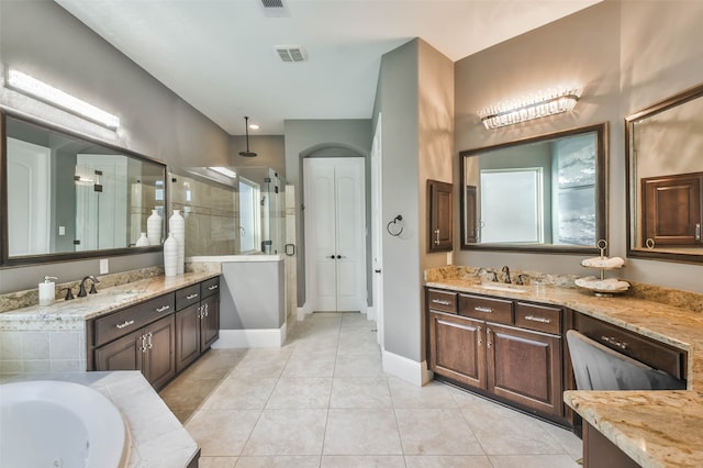 bathroom featuring tile patterned floors, vanity, and an enclosed shower