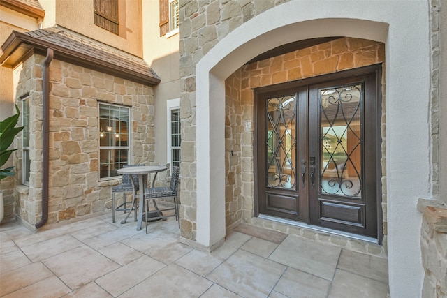 property entrance featuring french doors