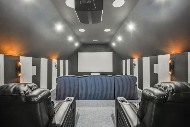 home theater with carpet and lofted ceiling