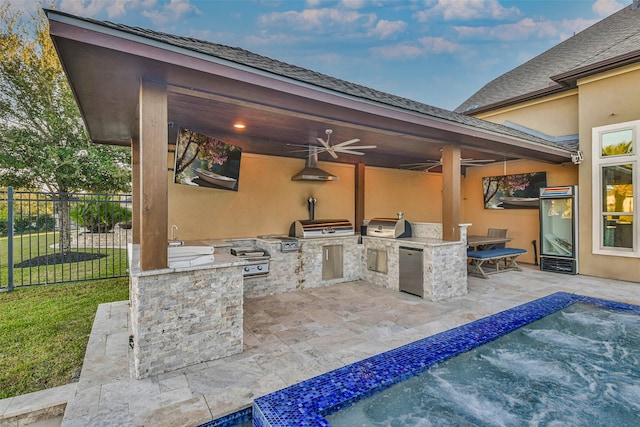 view of patio with a fenced in pool, a grill, ceiling fan, and an outdoor kitchen