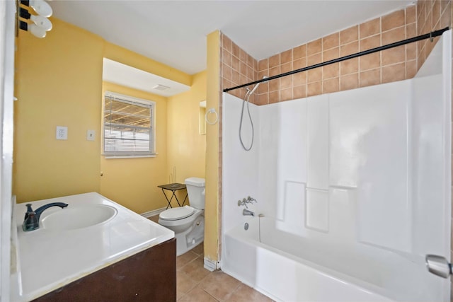 full bathroom with tile patterned flooring, vanity, toilet, and tiled shower / bath