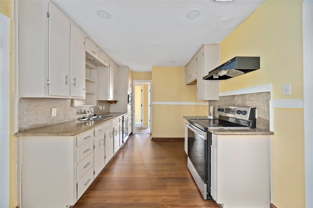 kitchen with ventilation hood, white cabinetry, and electric stove