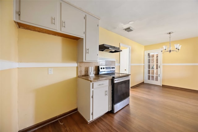 kitchen featuring dark hardwood / wood-style flooring, pendant lighting, white cabinets, stainless steel range with electric cooktop, and range hood