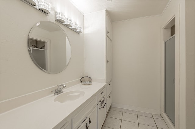 bathroom with tile patterned floors, vanity, a shower with shower door, and ornamental molding