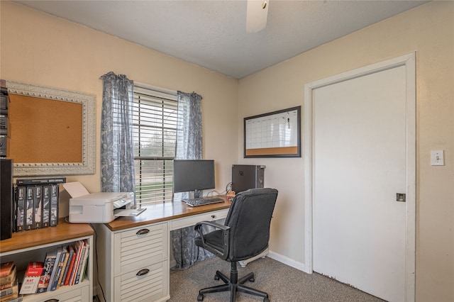 office with carpet flooring, ceiling fan, and a textured ceiling