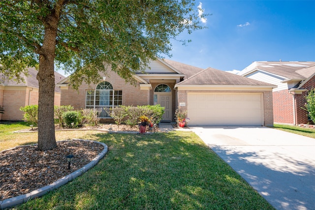 ranch-style home featuring a garage and a front yard