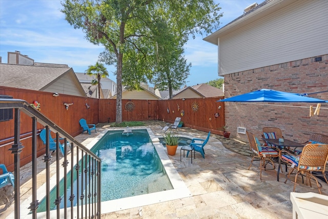 view of pool featuring a patio area