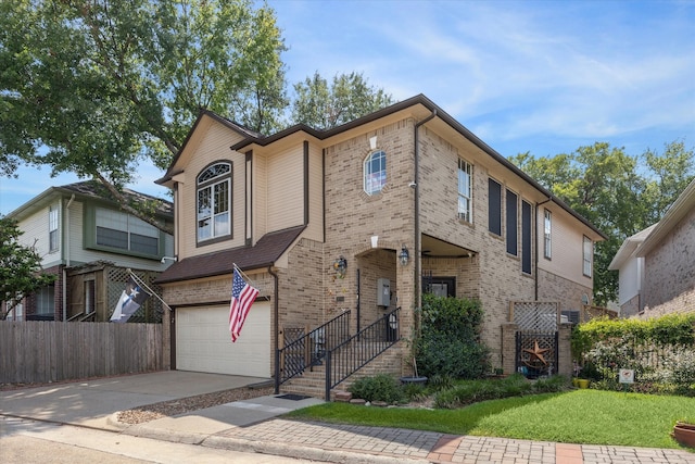 view of front of property featuring a front lawn and a garage