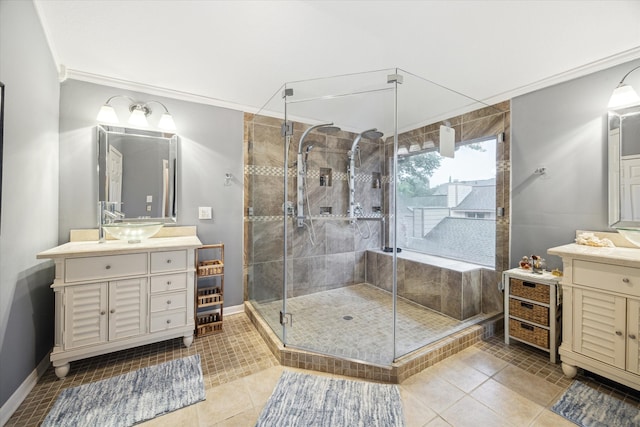 bathroom with tile patterned floors, vanity, an enclosed shower, and crown molding