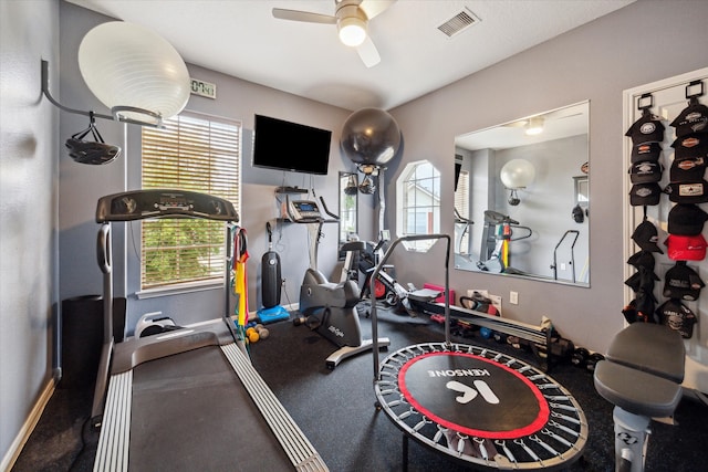 workout area featuring ceiling fan