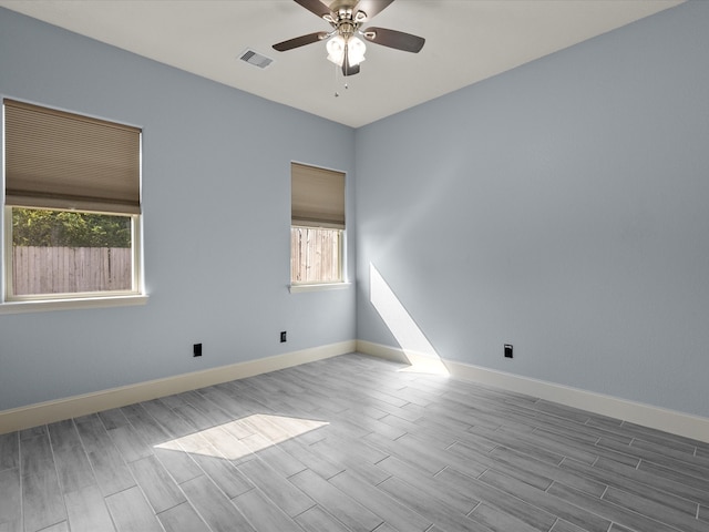 empty room with light hardwood / wood-style floors and ceiling fan